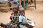 Two children sitting after having lunch