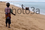 Child fishing at Keta beach