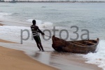 fisherman in a boat at Keta Beach