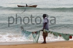 fisherman with net  at keta beach