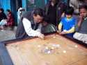 Tibetan people playing a game - Darjeeling - India