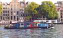 Floating house in the channels of Amsterdam - Holland