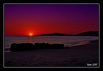 Puesta de sol purpura en las playas de Cadiz