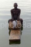 ashanti fisherman over a plank to fish in the sacred busomtwe lake