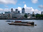 Barge on the Thames with the city in the background. London