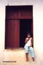 Go to big photo: Girl in a window in Nandaime - Nicaragua